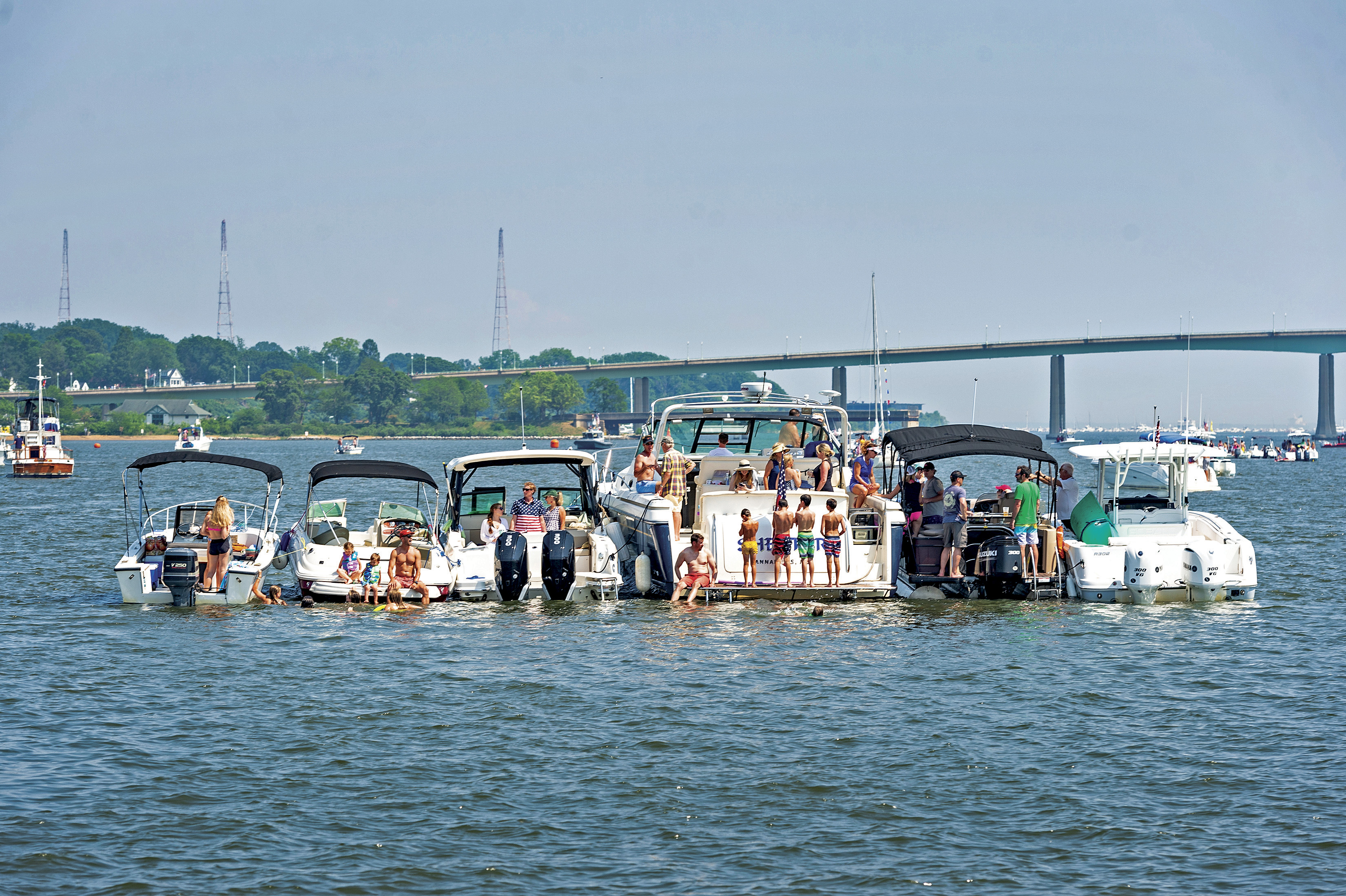 Docking, anchoring, or rafting within 20 feet of boats running generators or engines increases the chances of carbon monoxide poisoning and possibly even death. (CREDIT: Stacey Nedrow-Wigmore/BoatUS)